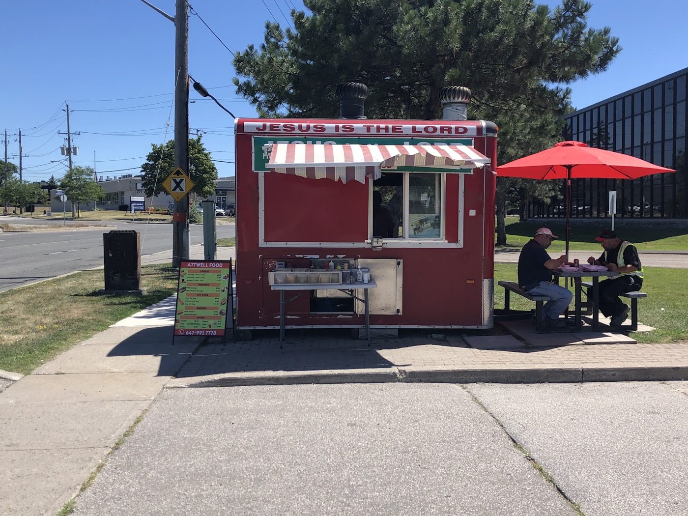 The red Attwell Food cart parked on Attwell Drive